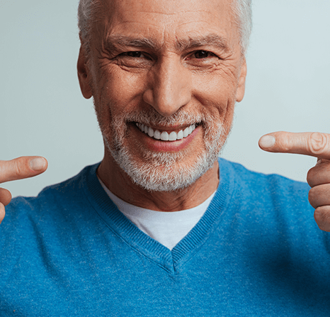 Older man proud of his new dentures